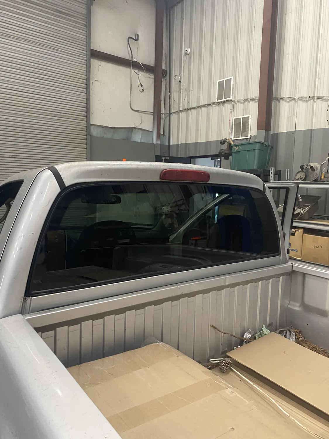 Pickup truck rear glass replacement, viewed from the bed