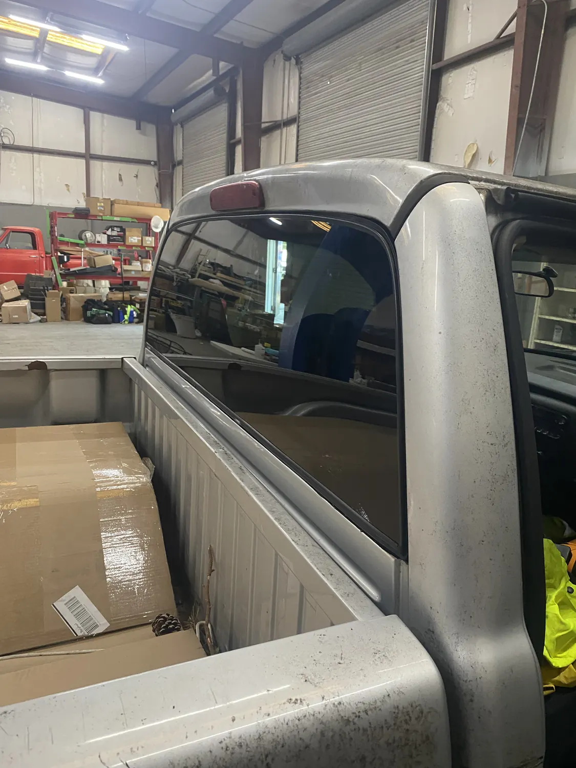 Pickup truck cab rear glass during a back glass replacement