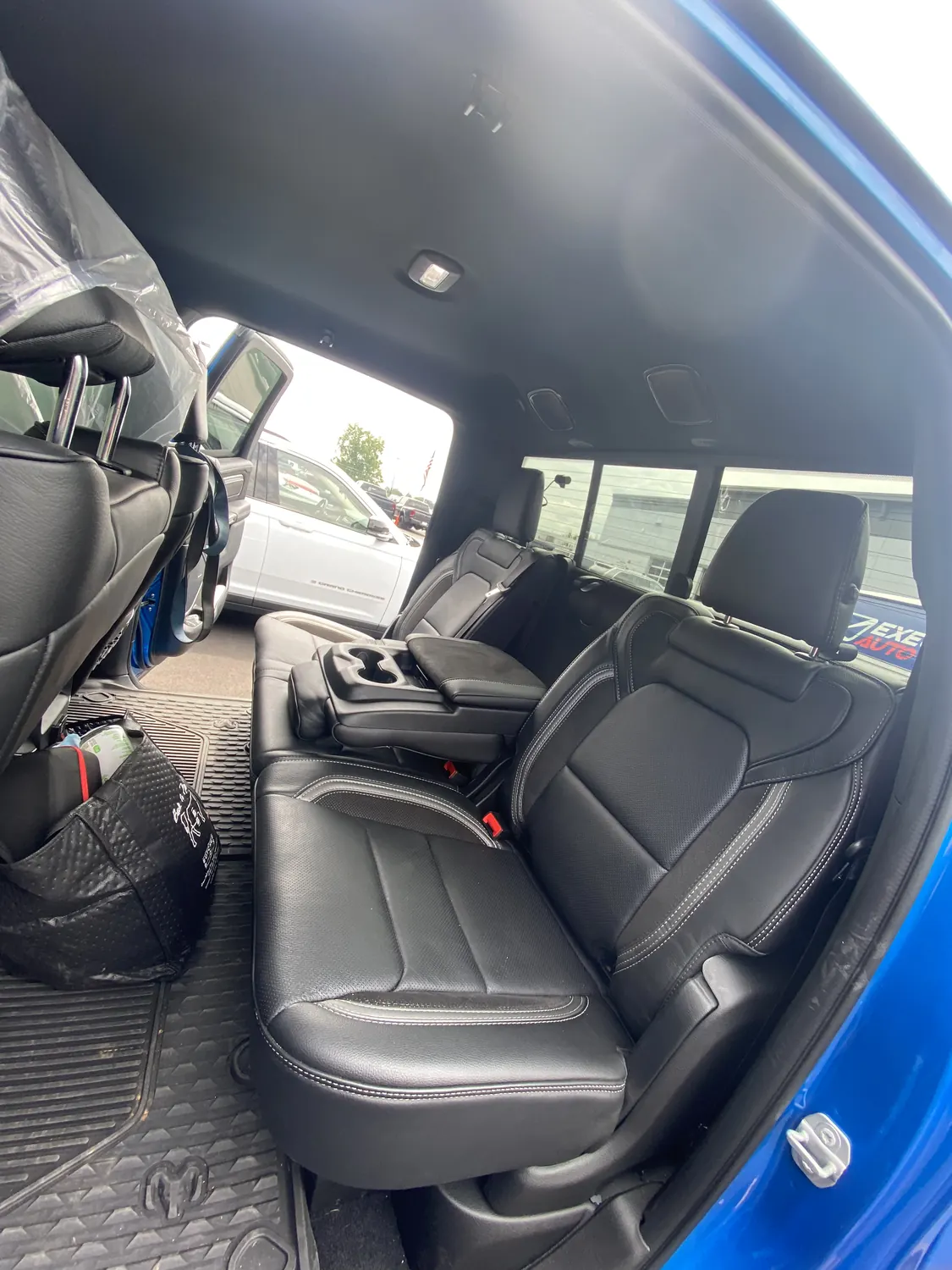 Interior door and window of a blue pickup during door glass service