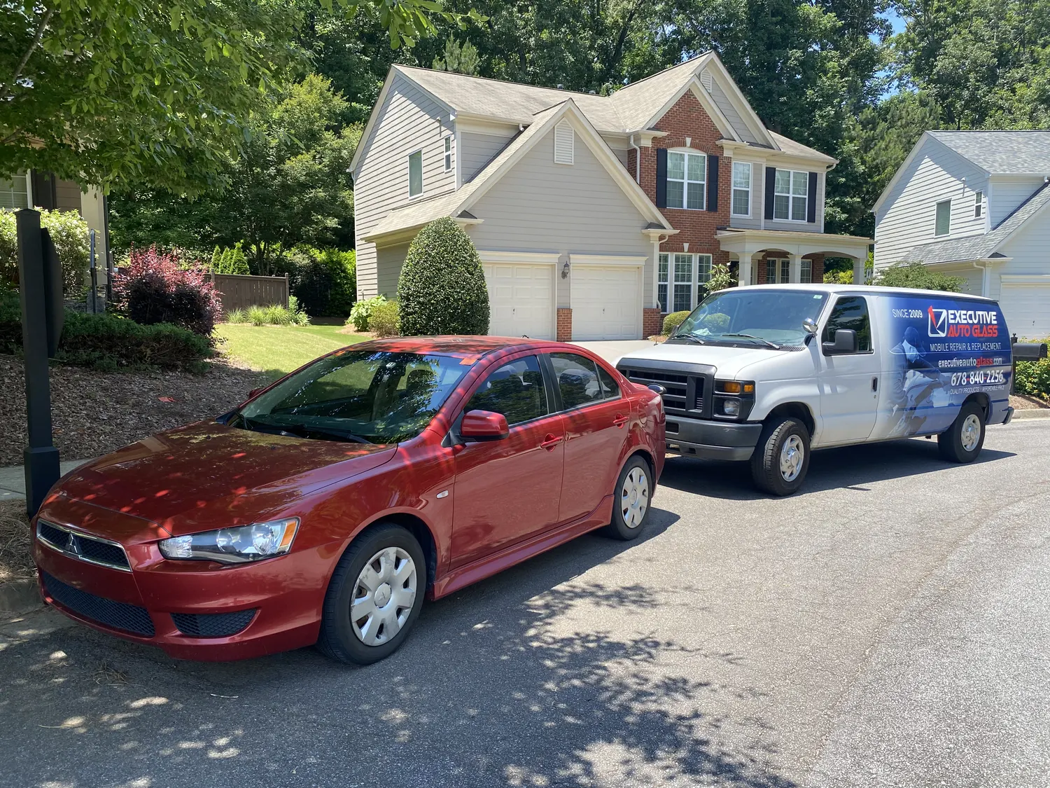 Executive Auto Glass on site for a mobile job on a residential street