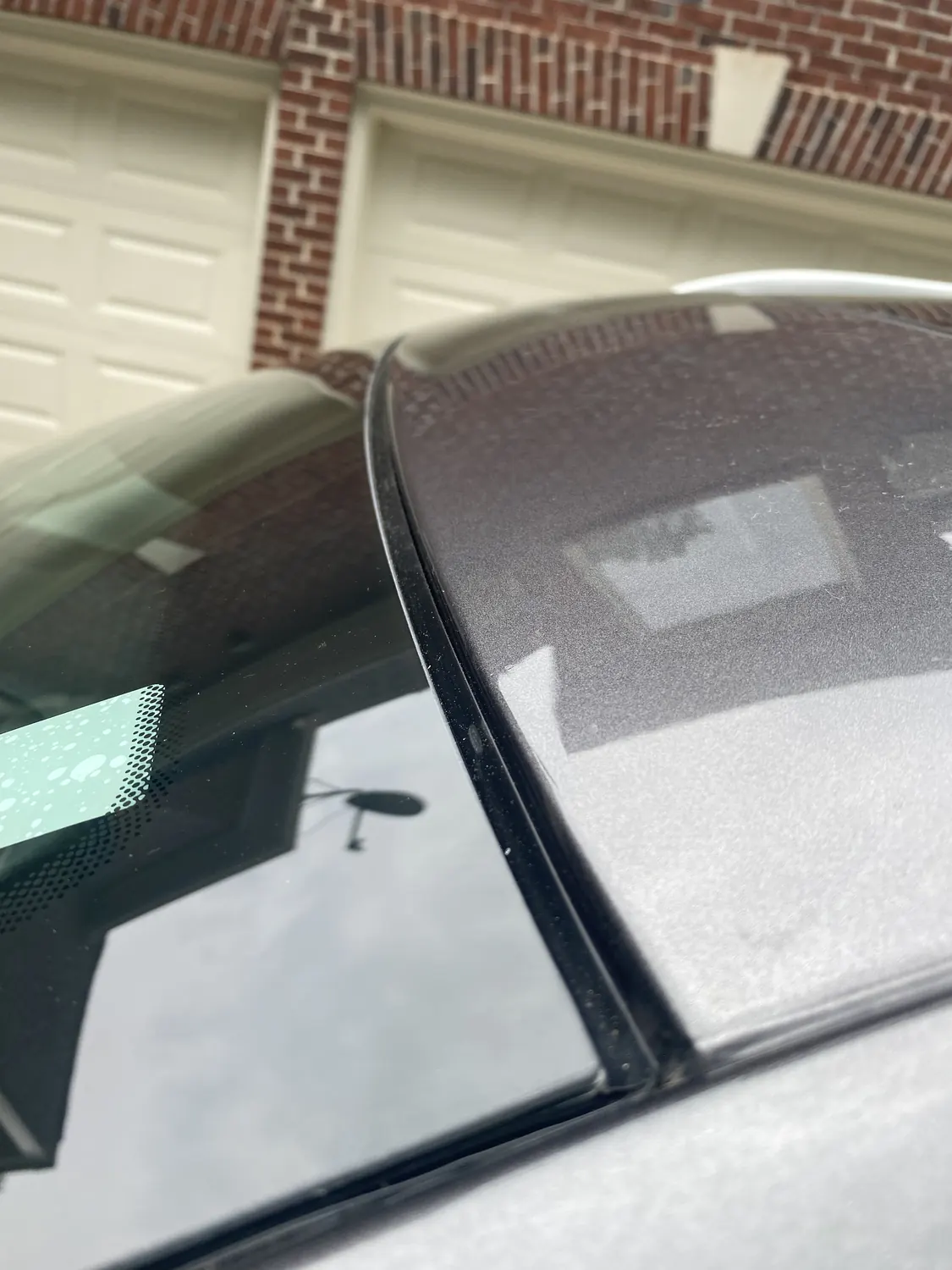 Close-up of a new windshield set against the A-pillar