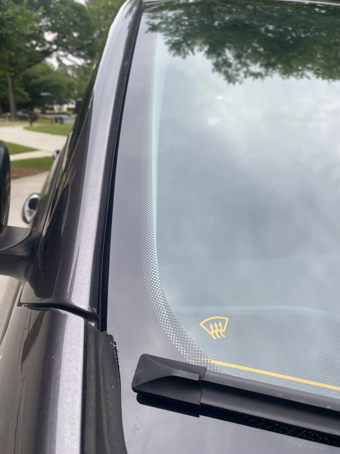 New windshield with the rain and camera sensor bracket at the top