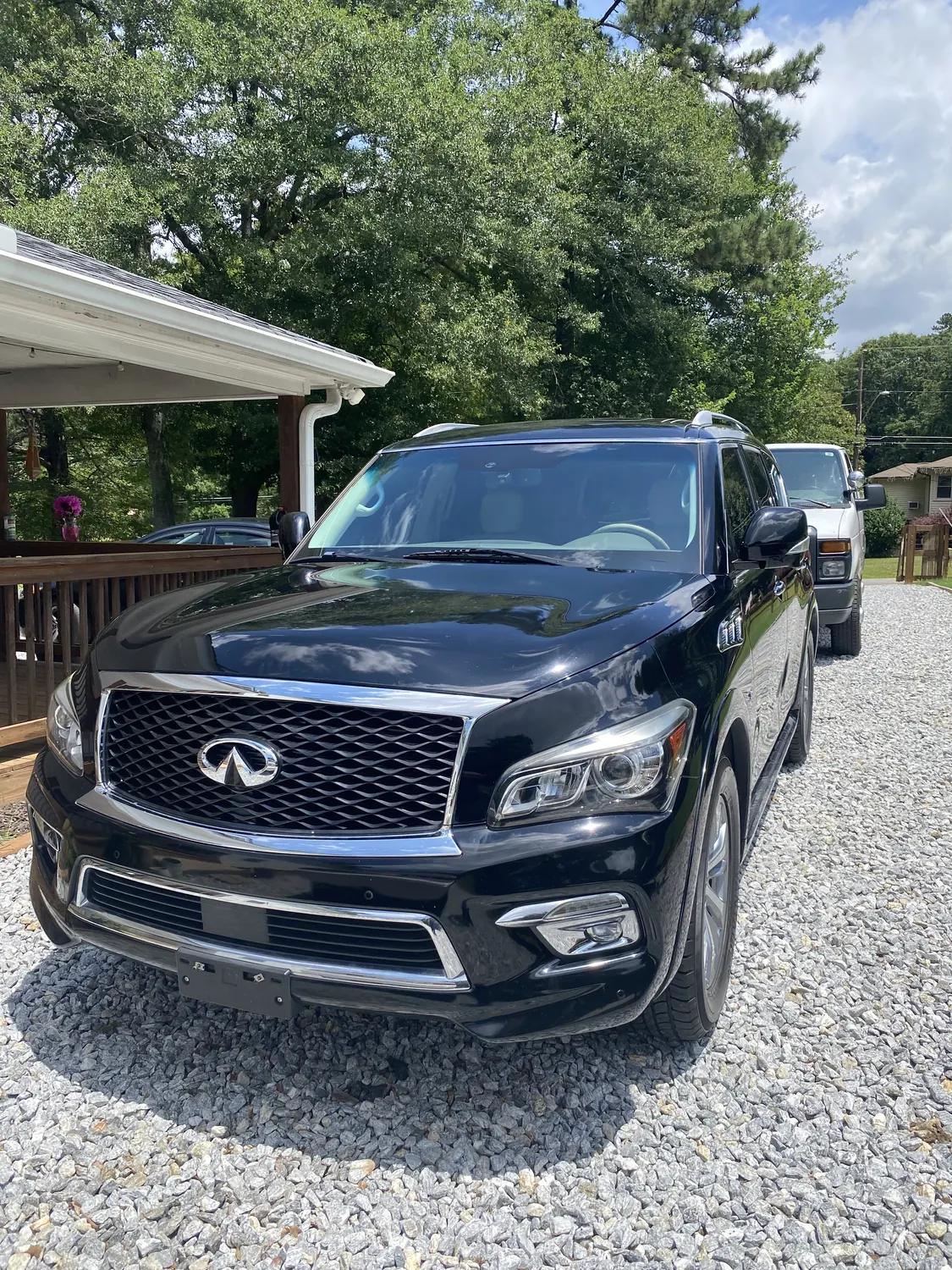 Black Infiniti QX80 SUV after a mobile windshield replacement
