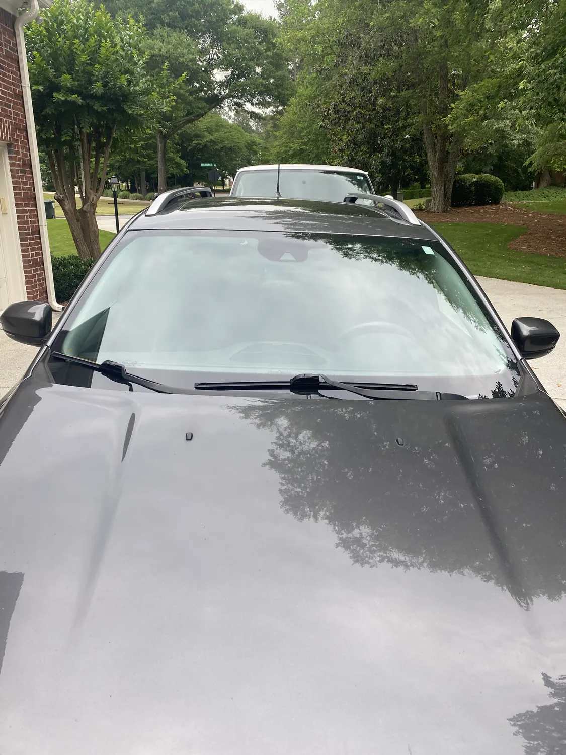 Jeep SUV windshield replacement in a driveway