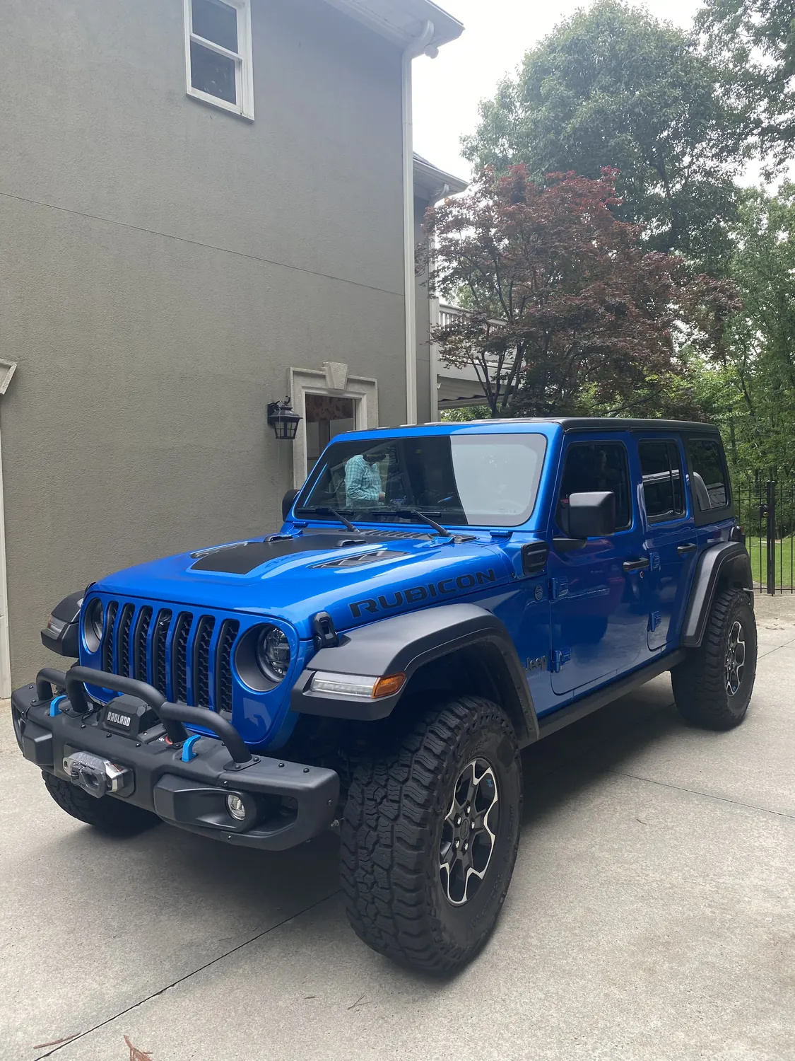 Blue Jeep Wrangler windshield replacement, front view