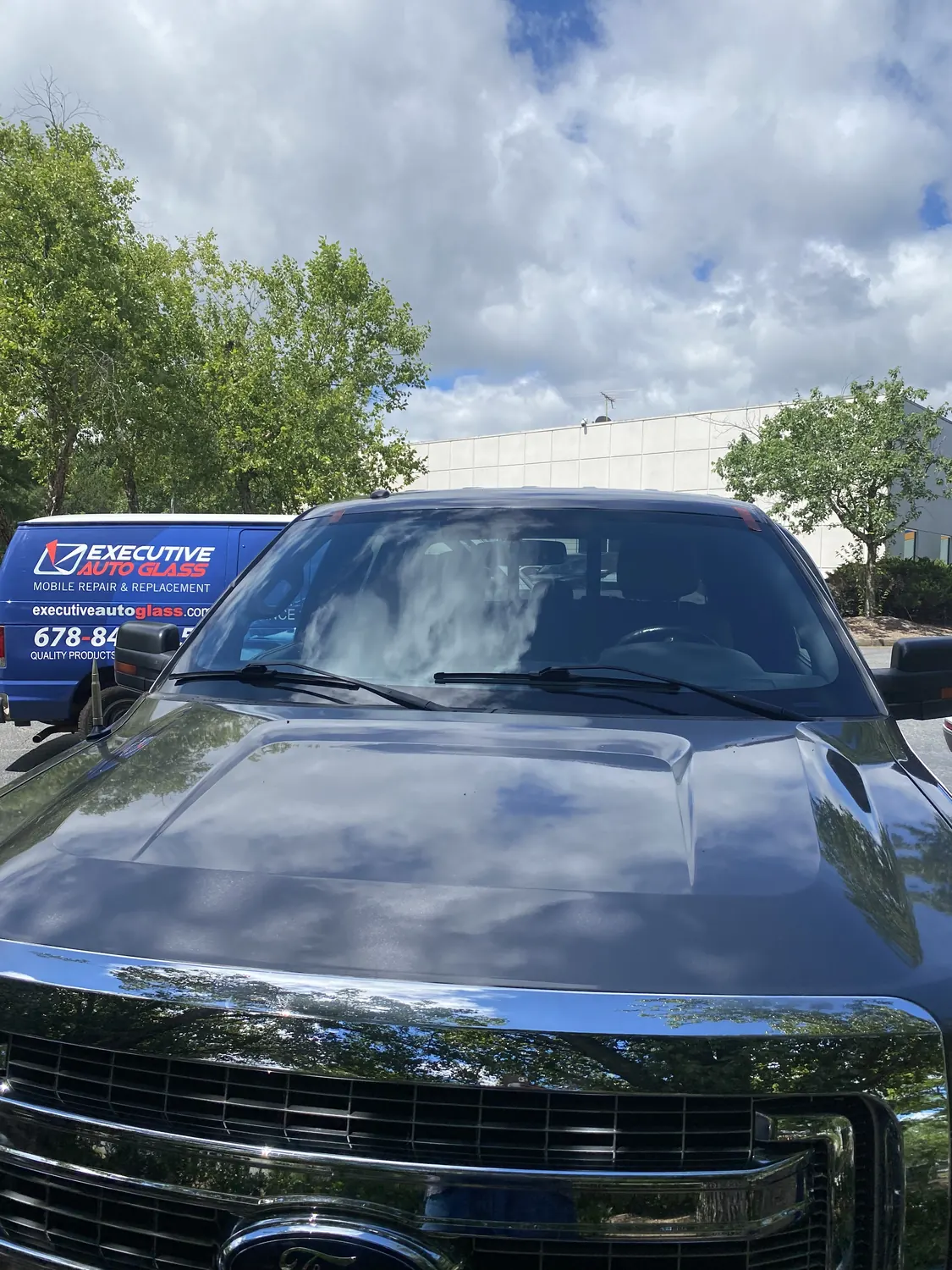 Black pickup truck after a mobile windshield replacement
