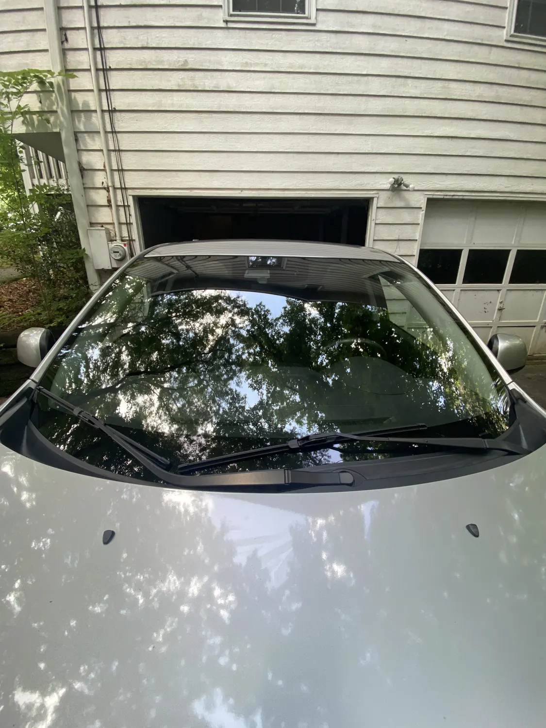 Dark sedan after a mobile windshield replacement