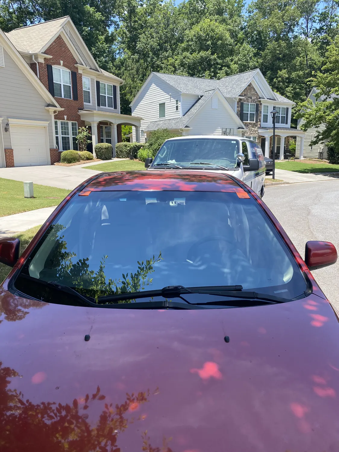 Red sedan after a mobile windshield replacement