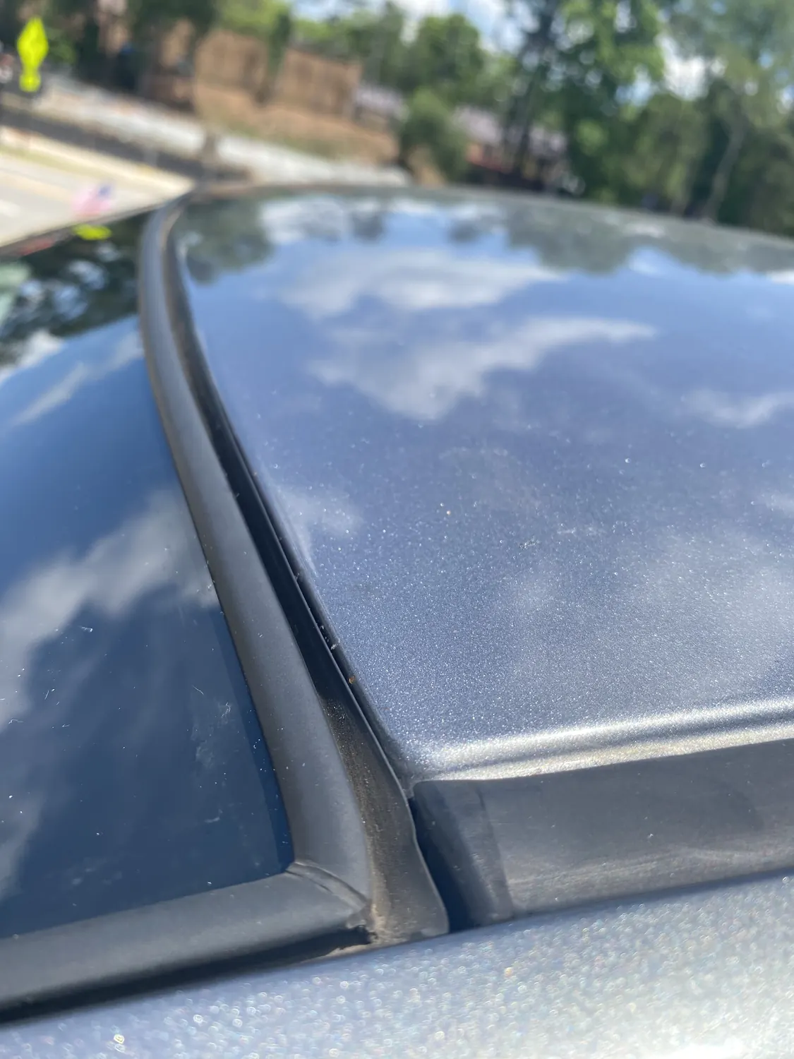 Close-up of an SUV windshield and roofline