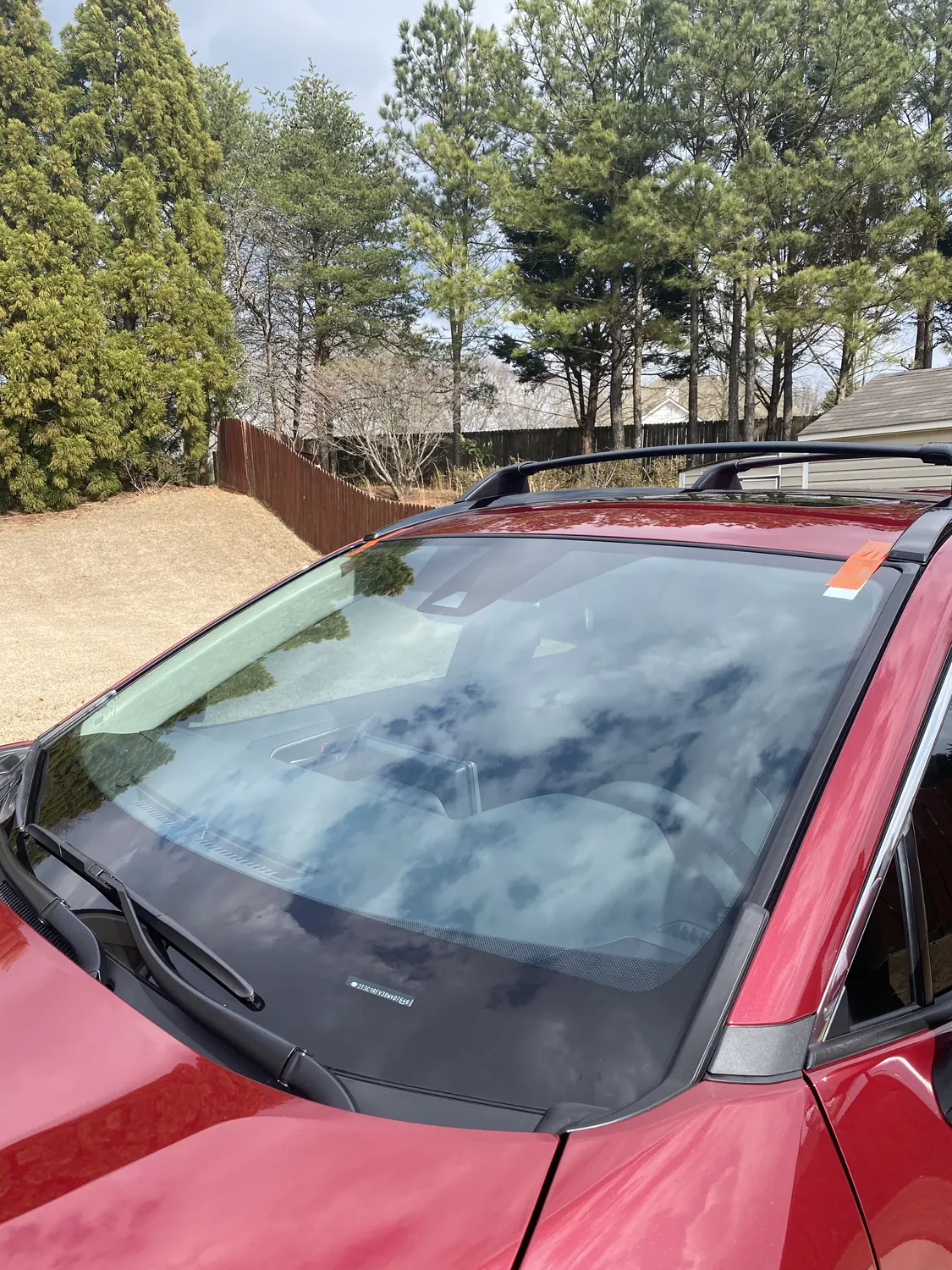 Red Toyota RAV4 windshield close-up after replacement